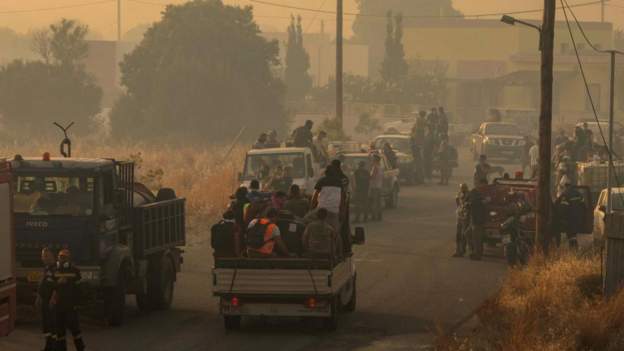 Evacuations continue as thousands flee Greece fires