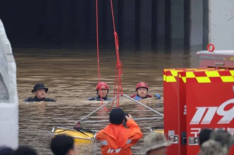 Rescuers pull dead bodies from flooded tunnel as rain wrecks havoc in Korea