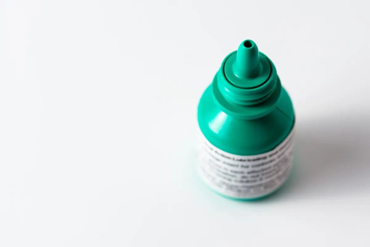 Overhead shot of a small bottle of liquid eye drops