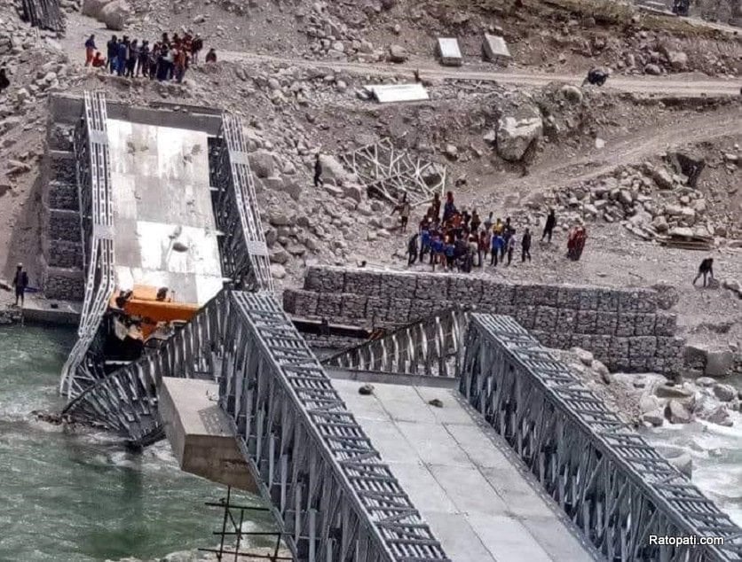 Flood-fed Melamchi sweeps away a temporary bridge