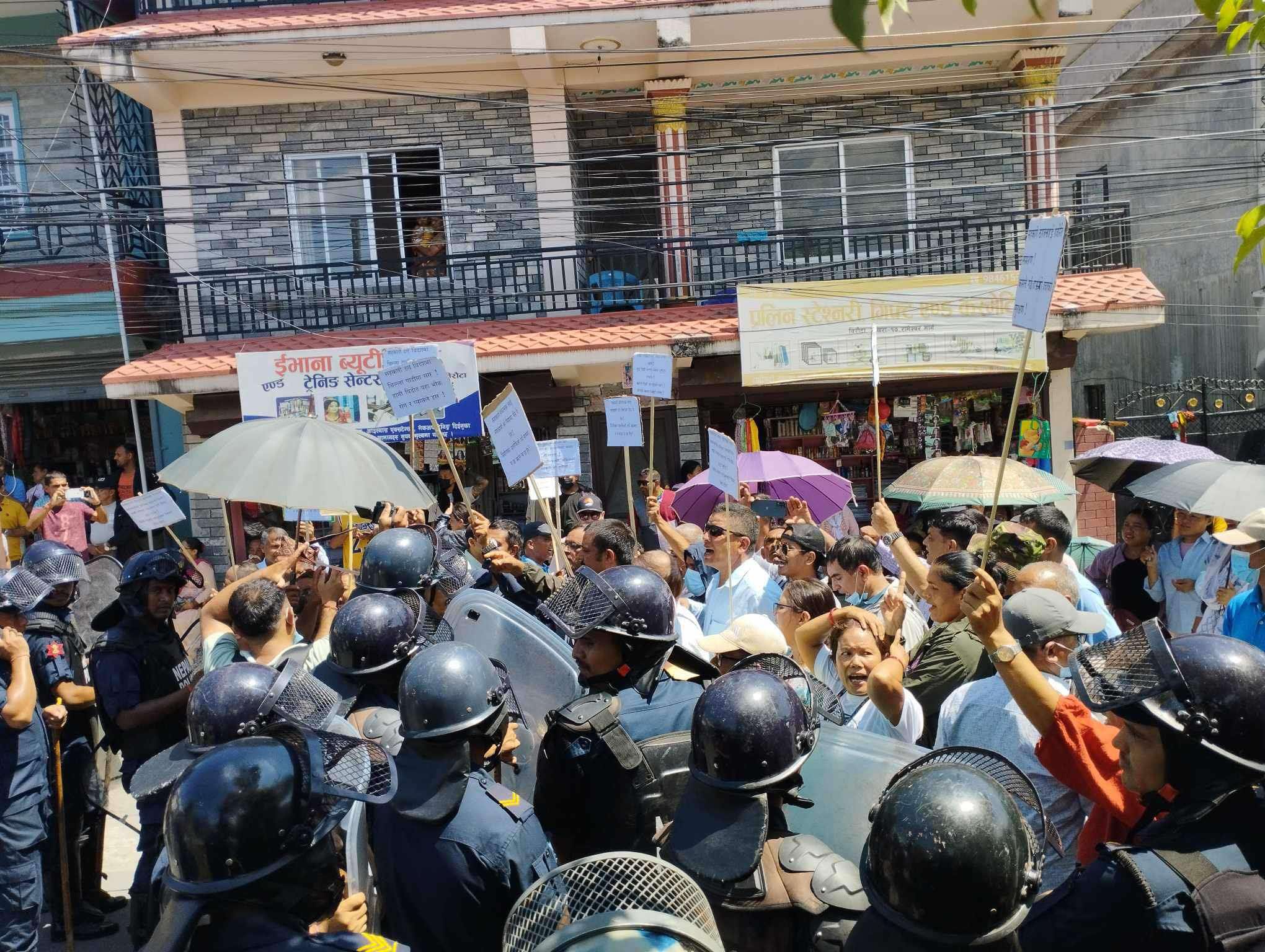 Protesters show black flag to Lamichhane in Pokhara