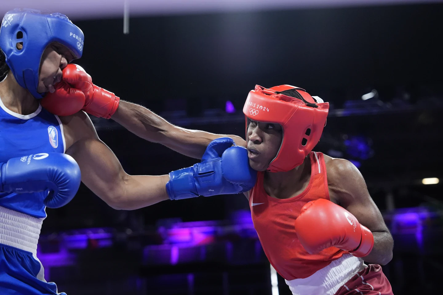 Boxer Cindy Ngamba becomes first athlete competing as a refugee to clinch an Olympic medal