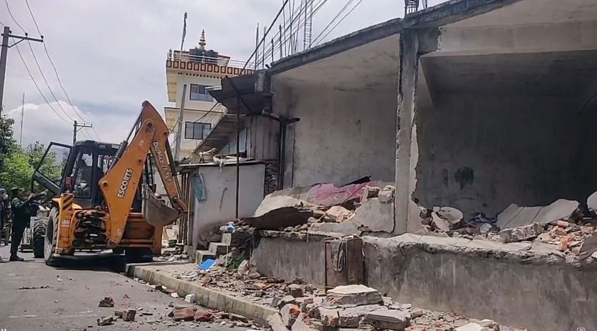 Kathmandu Metropolitan runs dozer on Bhadrakumari Ghale Sewa Sadan