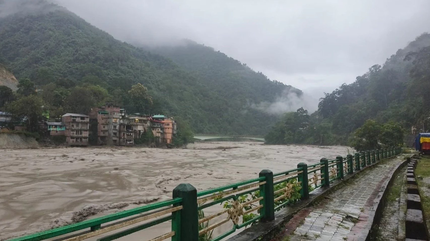 Flash floods kill at least 14 in northeastern India and leave more than 100 missing