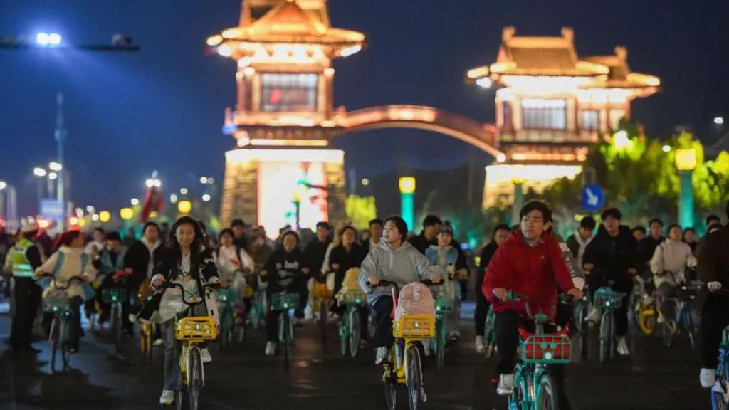 China roads blocked by thousands of cyclists in night quest for dumplings