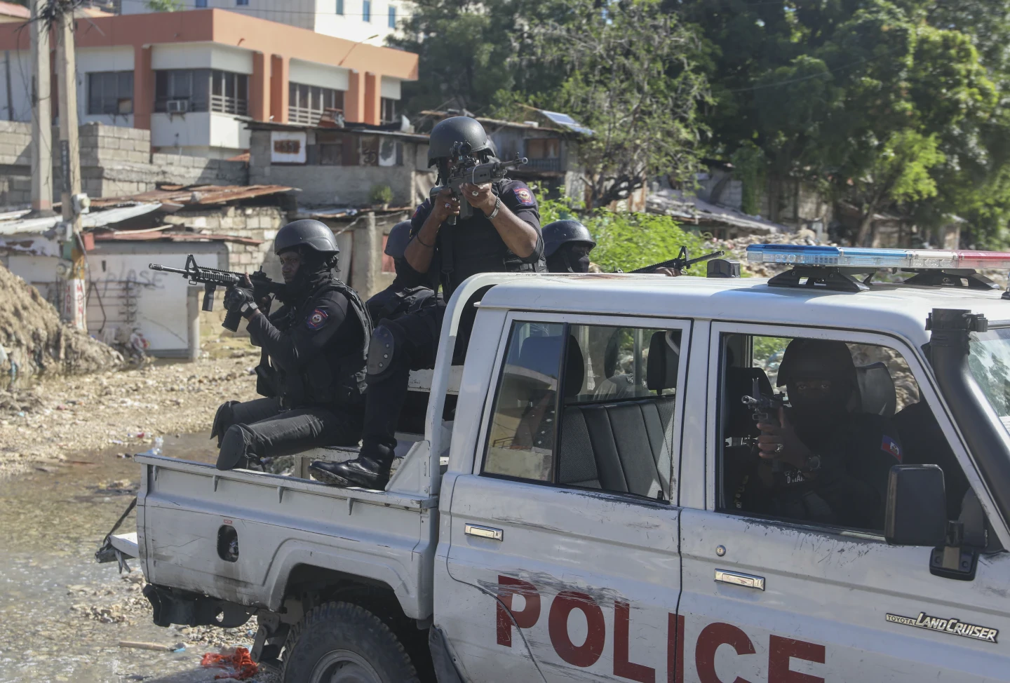 Haiti’s main airport shuts down as gang violence surges and a new prime minister is sworn in