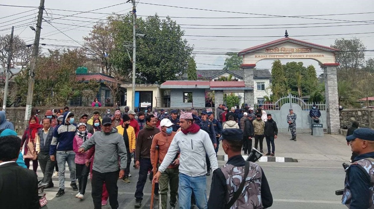 Victims of Surydarshan Cooperative protest on road in front of Kaski District Court