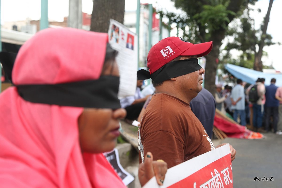 Meter-Byaj Victims Protest in Kathmandu with Black Blindfolds