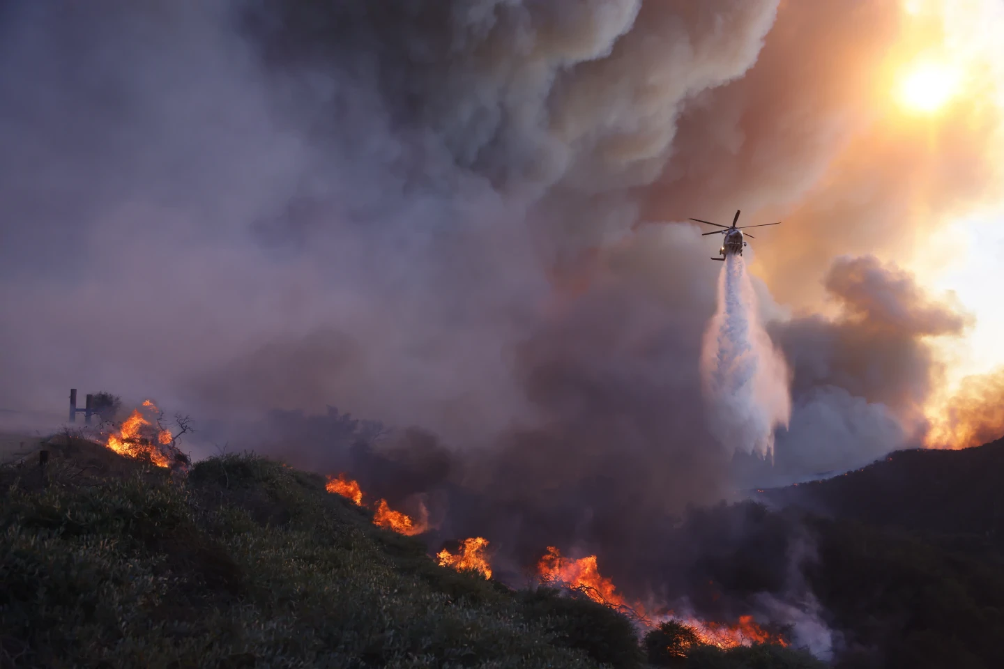 Pacific Palisades wildfire destroys structures as winds kick up in Los Angeles