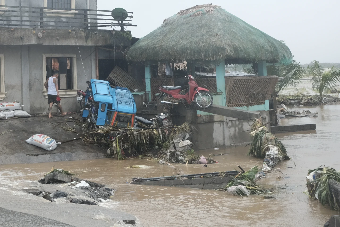 Tropical storm battering Philippines leaves at least 24 people dead