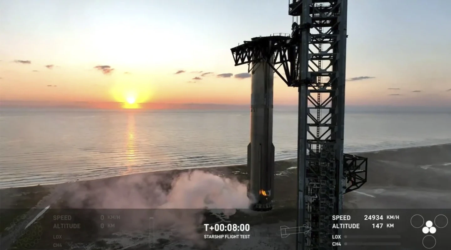 SpaceX arms catch Starship rocket booster back at the launch pad